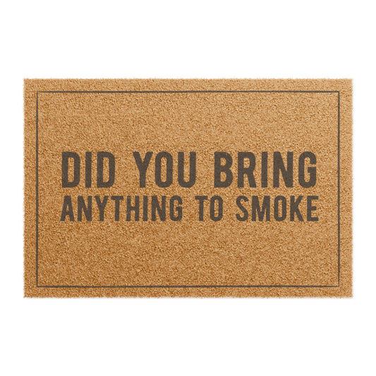 Top view of the Did You Bring Anything to Smoke coir doormat, dark lettering inside a thin border on natural tan fiber