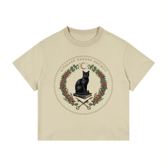 Kids’ Literary Garden Society Loose Fit T-Shirt in khaki with the black cat and roses crest, front print