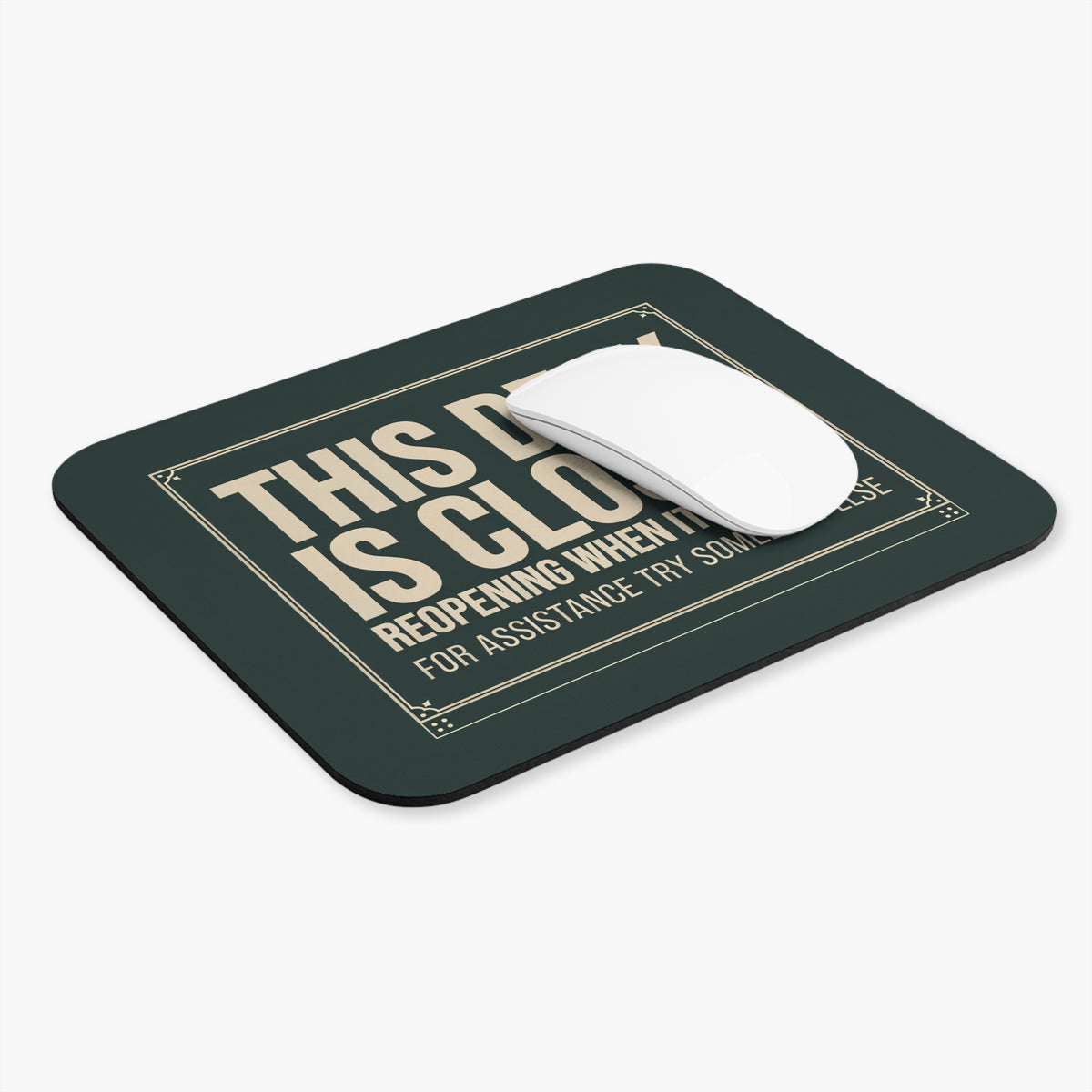 This desk is closed mouse pad at an angle with a white computer mouse