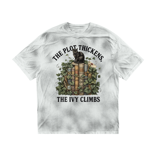 Women’s dirty-washed loose tee with a black cat on ivy-covered books, The Plot Thickens, The Ivy Climbs front print