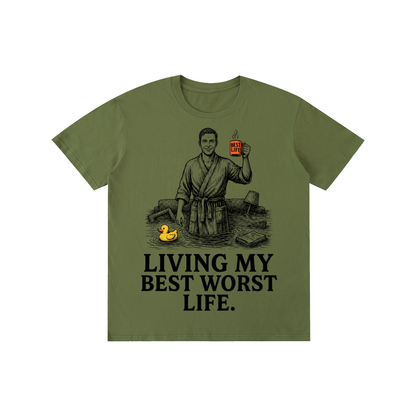 Army Green cotton crewneck t-shirt with a vintage illustration of a smiling man in a bathrobe raising a mug in a flooded room beside a rubber duck above bold Living my best worst life text on the front