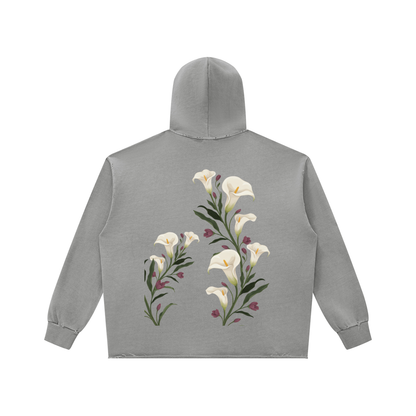 Light gray calla lily vintage wash raw edge hoodie, back view with a tall bunch of white calla lilies