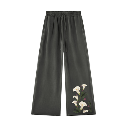 Dark gray calla lily wide leg sweatpants, front view with white lilies climbing the lower leg and drawstring waist