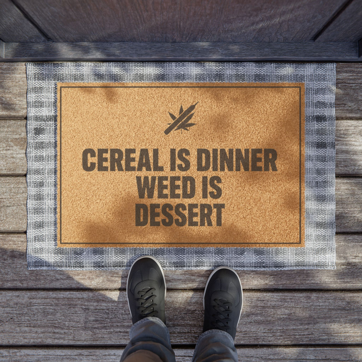 Cereal Is Dinner Weed Is Dessert coir doormat on a wooden porch seen from above with a pair of shoes at the edge