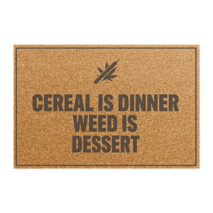 Top view of the Cereal Is Dinner Weed Is Dessert coir doormat, dark lettering inside a thin border on natural tan fiber