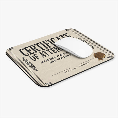 Certificate of attendance mouse pad at an angle with a white computer mouse