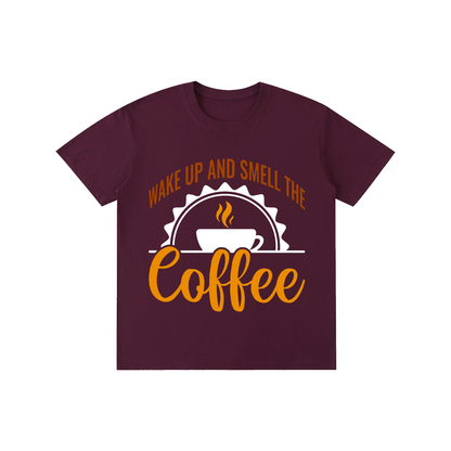 Grape Purple cotton crewneck t-shirt with a rust brown Wake up and smell the coffee design with a white coffee cup and orange cursive Coffee on the front