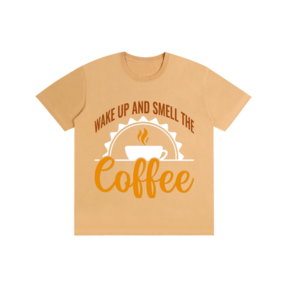 Khaki cotton crewneck t-shirt with a rust brown Wake up and smell the coffee design with a white coffee cup and orange cursive Coffee on the front
