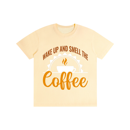 Light Apricot cotton crewneck t-shirt with a rust brown Wake up and smell the coffee design with a white coffee cup and orange cursive Coffee on the front