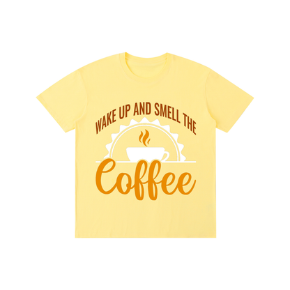 Yellow cotton crewneck t-shirt with a rust brown Wake up and smell the coffee design with a white coffee cup and orange cursive Coffee on the front
