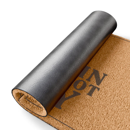 Rolled-up corner of the Come In We Forgot Why Smoke Icon Layout coir doormat showing the black vinyl backing