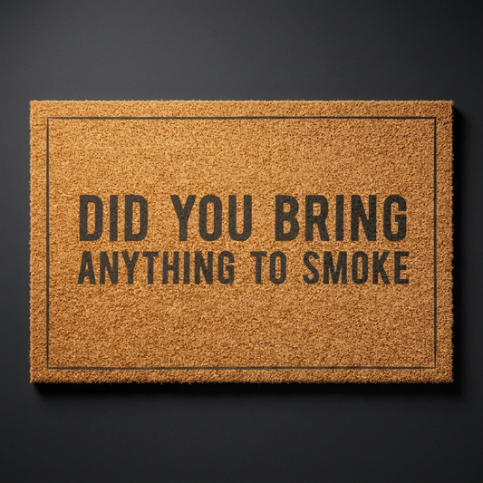 Did You Bring Anything to Smoke coir doormat with dark lettering on natural tan coir, shown at an angle on a dark studio backdrop