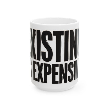 Funny coffee mug printed with "EXISTING IS EXPENSIVE", three-quarter view with the handle on the right