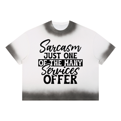 White boxy sunfade vintage wash t-shirt with black cursive and bold capital Sarcasm just one of the many services offer lettering with a black band on the front