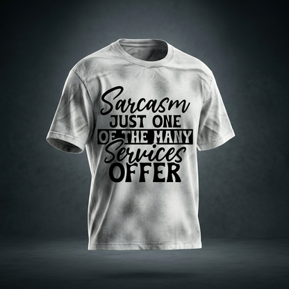 White gray dirty wash loose t-shirt with black cursive and bold capital Sarcasm just one of the many services offer lettering with a black band on the front shown against a dark studio backdrop