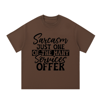 Coffee oversized cotton t-shirt with black cursive and bold capital Sarcasm just one of the many services offer lettering with a black band on the front