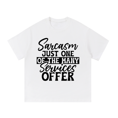 White oversized cotton t-shirt with black cursive and bold capital Sarcasm just one of the many services offer lettering with a black band on the front