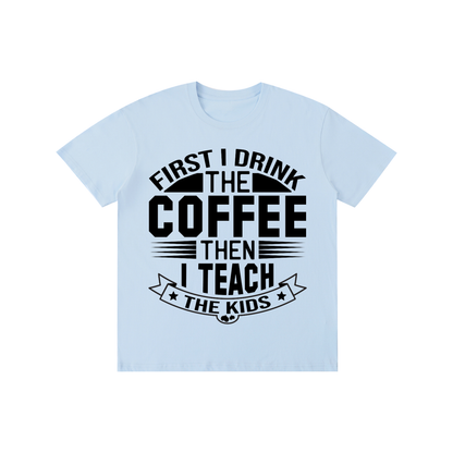 Sky Blue cotton crewneck t-shirt with black First I drink the coffee then I teach the kids lettering with a star ribbon banner on the front