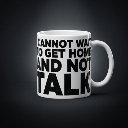 Funny coffee mug printed with "I CANNOT WAIT TO GET HOME AND NOT TALK", shown on a dark studio background