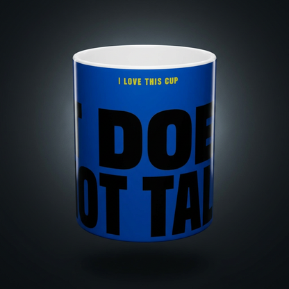 Funny coffee mug printed with "I LOVE THIS CUP / IT DOES NOT TALK", shown on a dark studio background