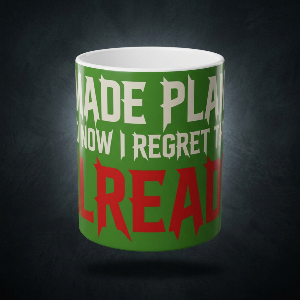 Funny coffee mug printed with "I MADE PLANS AND NOW I REGRET THEM ALREADY", shown on a dark studio background