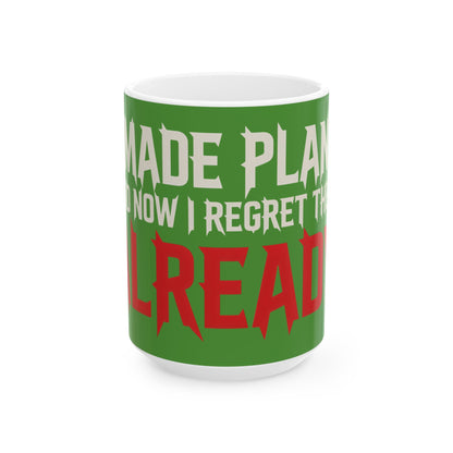 Funny coffee mug printed with "I MADE PLANS AND NOW I REGRET THEM ALREADY", three-quarter view with the handle on the right