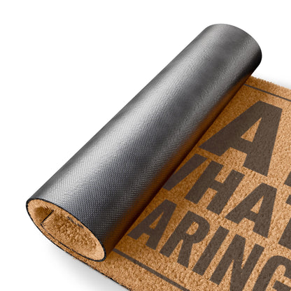 Rolled-up corner of the Is That Really What You Are Wearing coir doormat showing the black vinyl backing