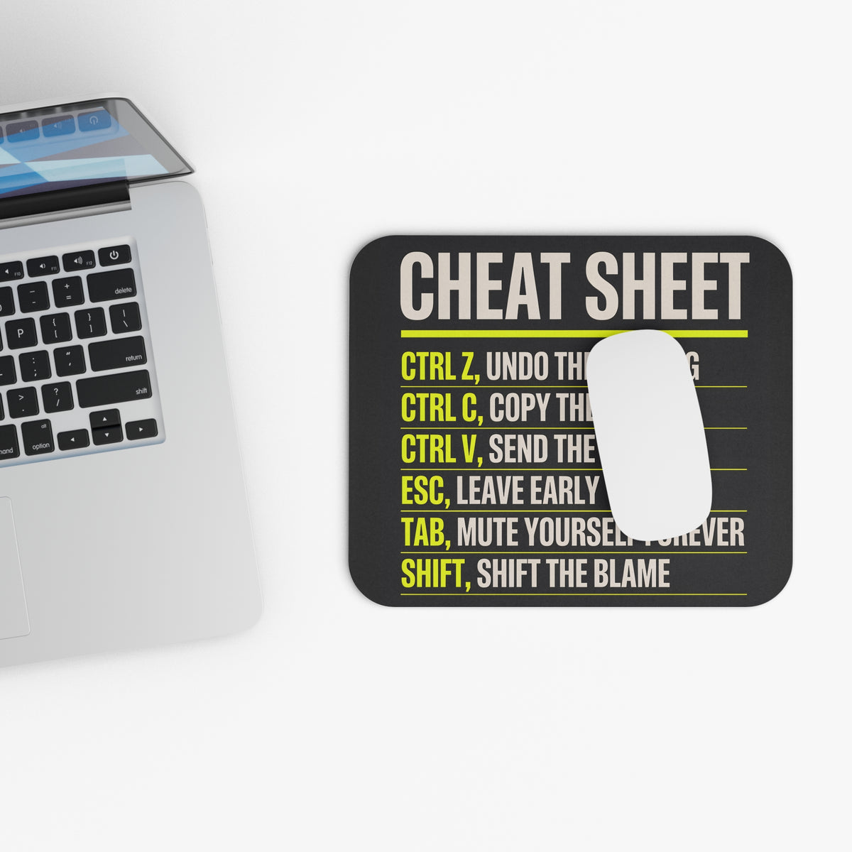Top view of the keyboard shortcuts mouse pad beside a laptop keyboard