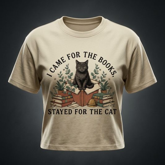 Kids’ loose-fit drop-shoulder tee with a black cat on a stack of books and plants, I Came for the Books, Stayed for the Cat front print