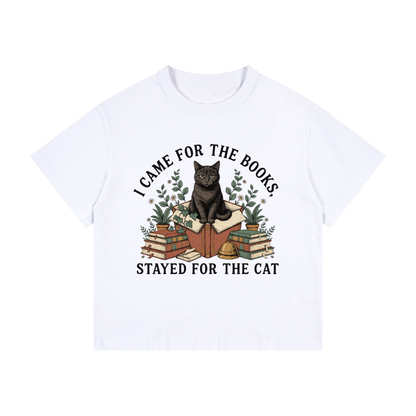Kids’ loose-fit drop-shoulder tee with a black cat on a stack of books and plants, I Came for the Books, Stayed for the Cat front print