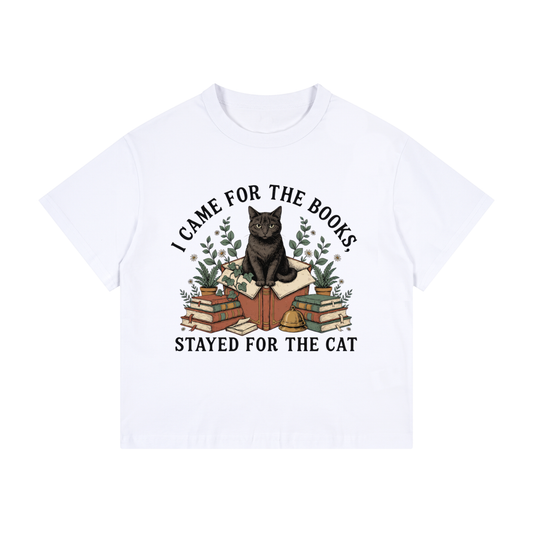Kids’ loose-fit drop-shoulder tee with a black cat on a stack of books and plants, I Came for the Books, Stayed for the Cat front print