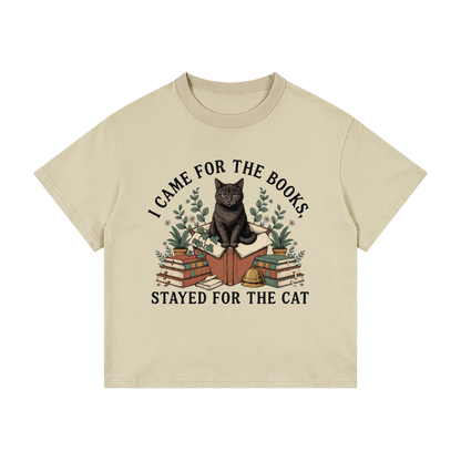 Kids’ loose-fit drop-shoulder tee with a black cat on a stack of books and plants, I Came for the Books, Stayed for the Cat front print