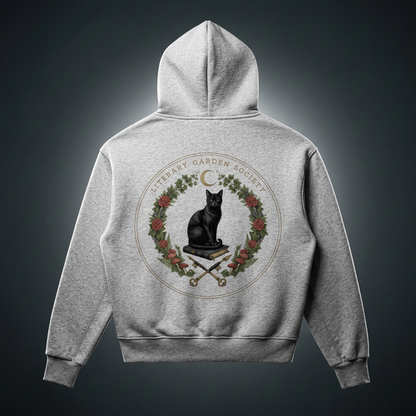 Back of a kids’ gray fleece hoodie with a Literary Garden Society seal of a black cat on a book framed by ivy, roses and mushrooms