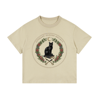 Kids’ Literary Garden Society Loose Fit T-Shirt in khaki with the black cat and roses crest, front print