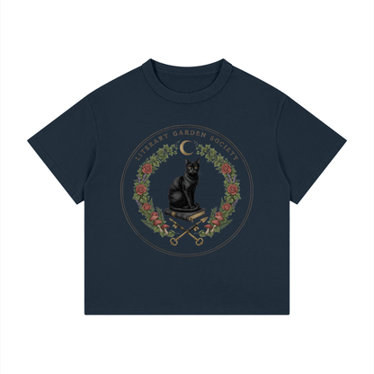 Kids’ Literary Garden Society Loose Fit T-Shirt in navy with the black cat and roses crest, front print