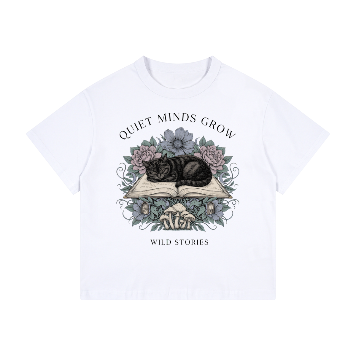 Kids’ loose-fit drop-shoulder tee with a sleeping black cat on an open book among flowers, Quiet Minds Grow, Wild Stories front print