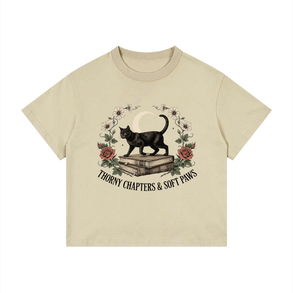 Kids’ loose-fit drop-shoulder tee with a black cat walking over old books under a crescent moon, Thorny Chapters & Soft Paws front print