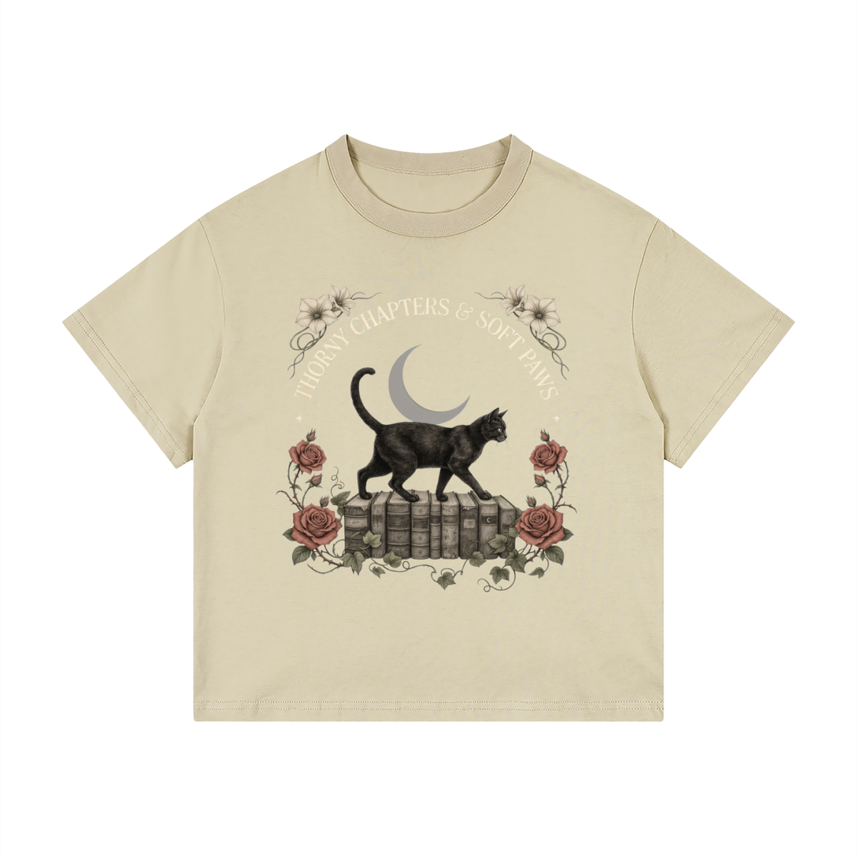 Kids’ loose-fit drop-shoulder tee with a black cat walking over old books under a crescent moon, Thorny Chapters & Soft Paws front print