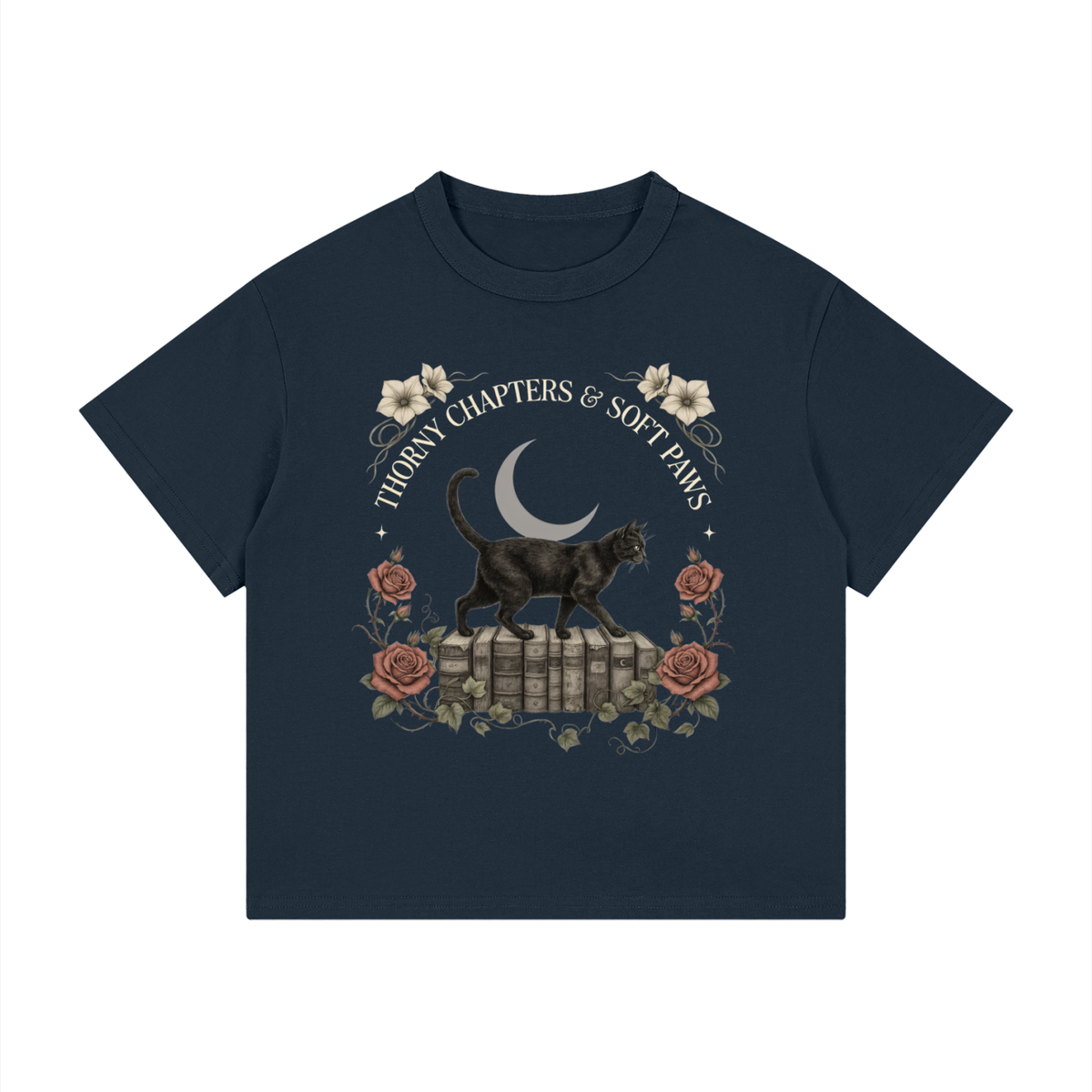 Kids’ loose-fit drop-shoulder tee with a black cat walking over old books under a crescent moon, Thorny Chapters & Soft Paws front print