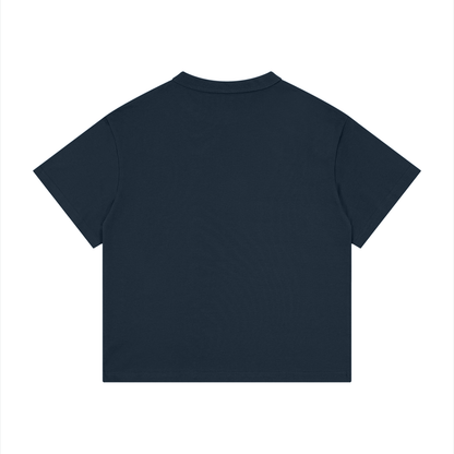 Kids’ loose-fit drop-shoulder tee with a black cat walking over old books under a crescent moon, Thorny Chapters & Soft Paws front print