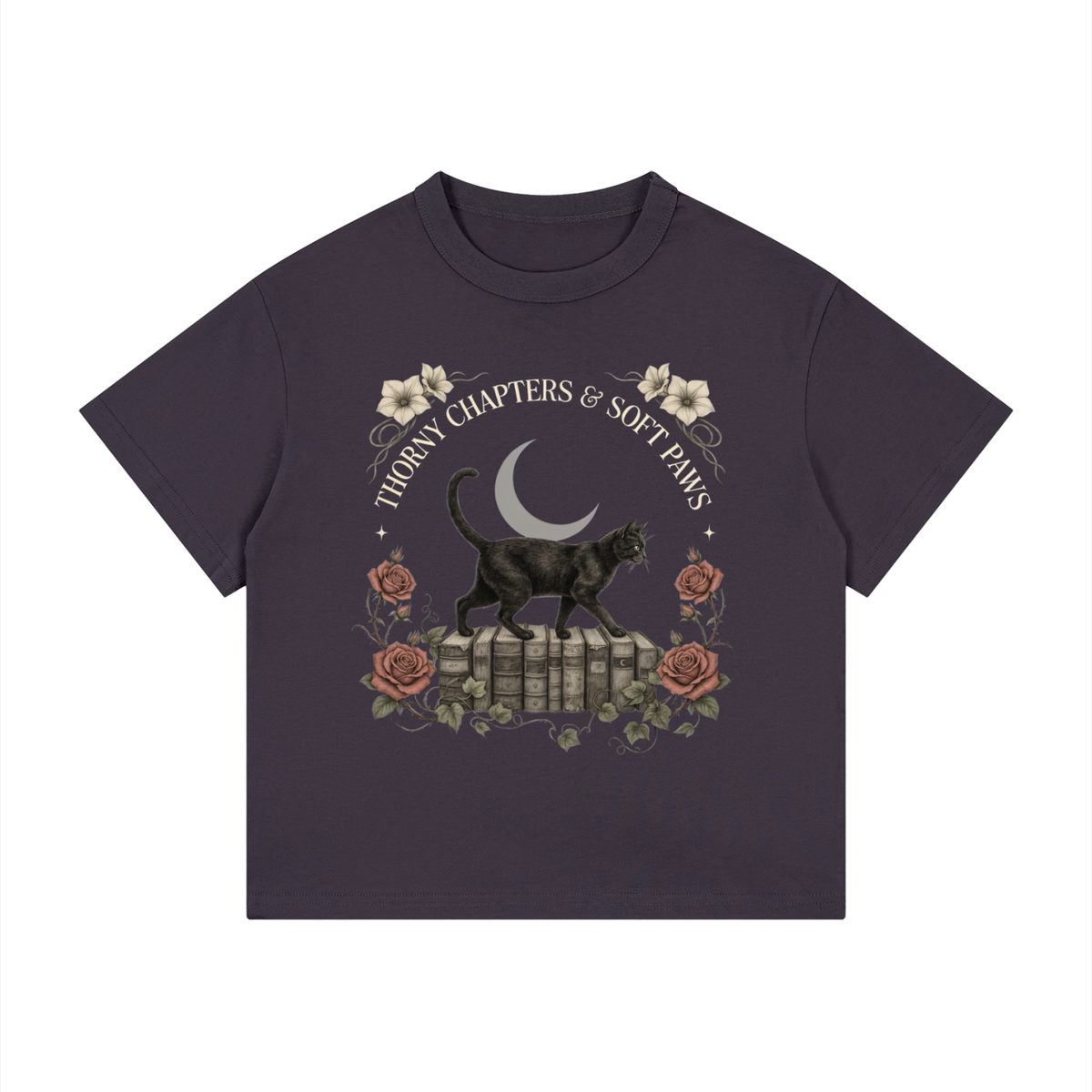 Kids’ loose-fit drop-shoulder tee with a black cat walking over old books under a crescent moon, Thorny Chapters & Soft Paws front print