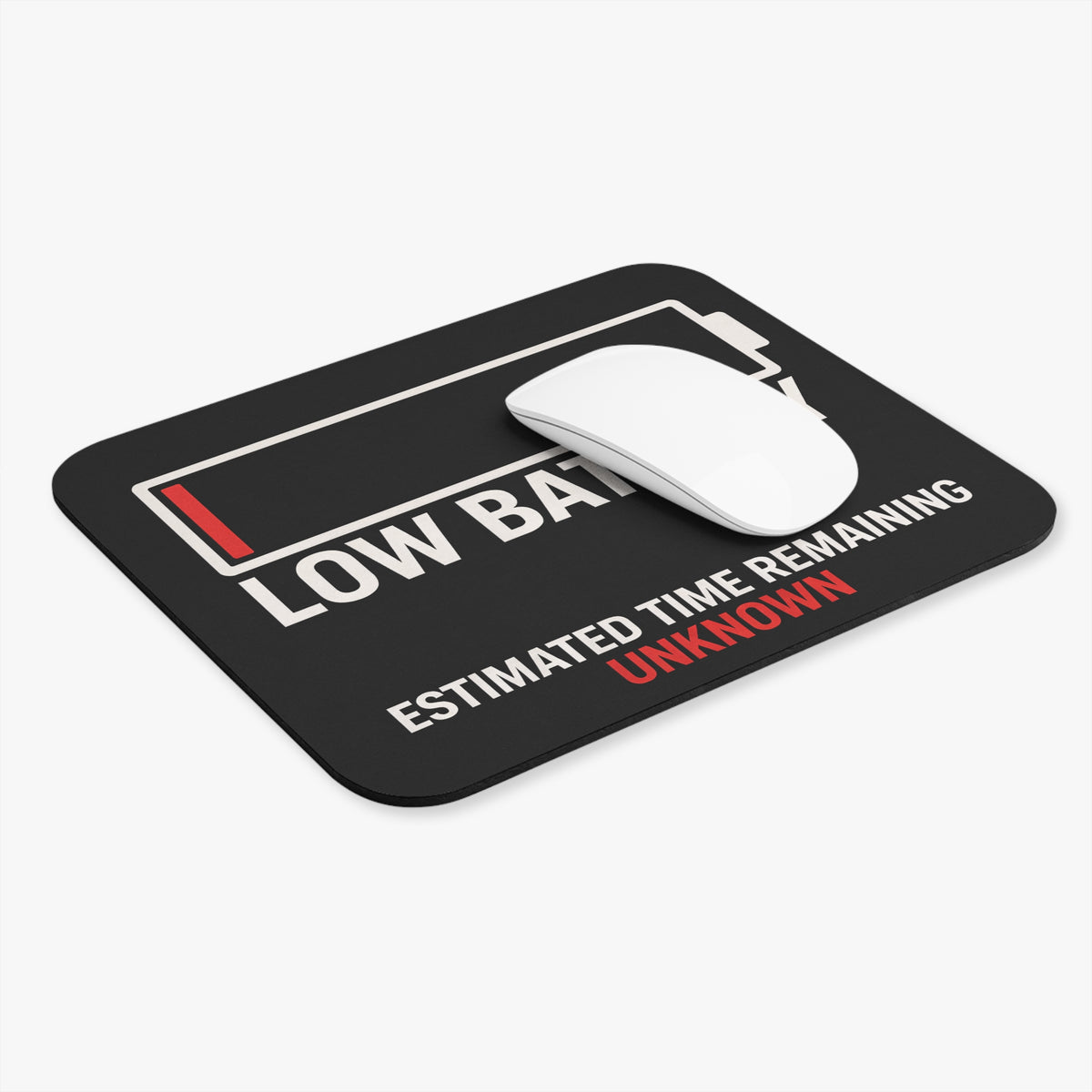 Low battery mouse pad at an angle with a white computer mouse