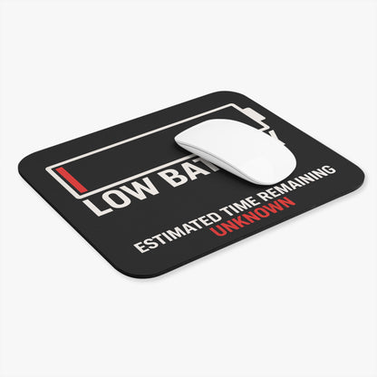 Low battery mouse pad at an angle with a white computer mouse