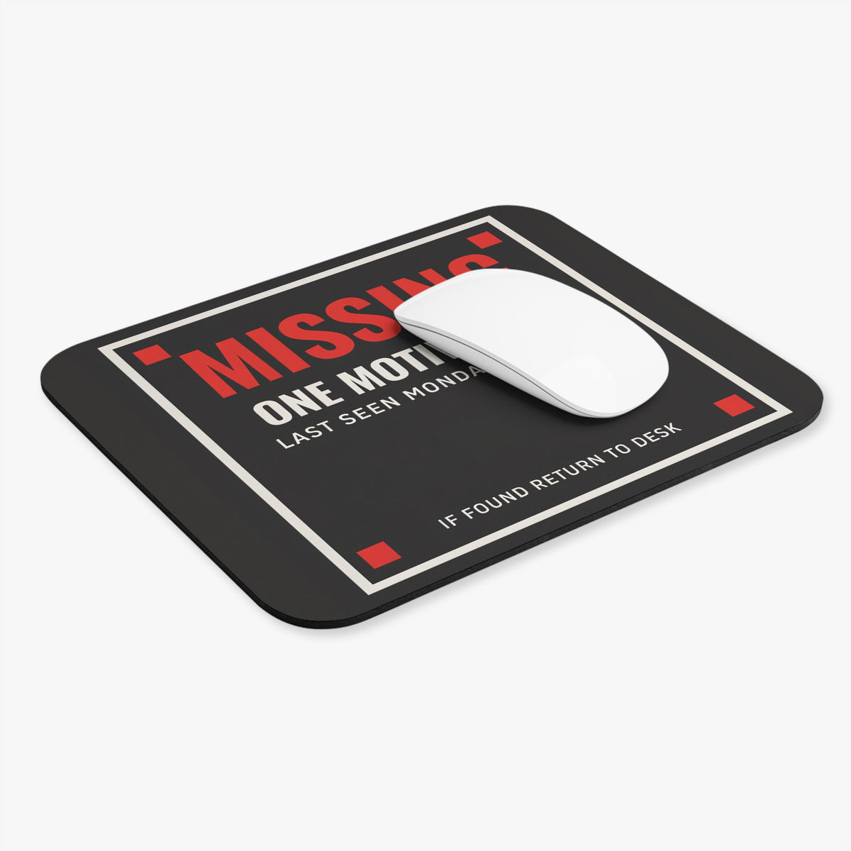 Missing motivation mouse pad at an angle with a white computer mouse