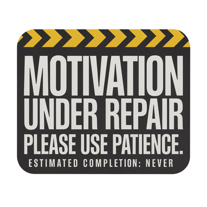 Funny motivation under repair mouse pad with yellow hazard stripes, flat front view
