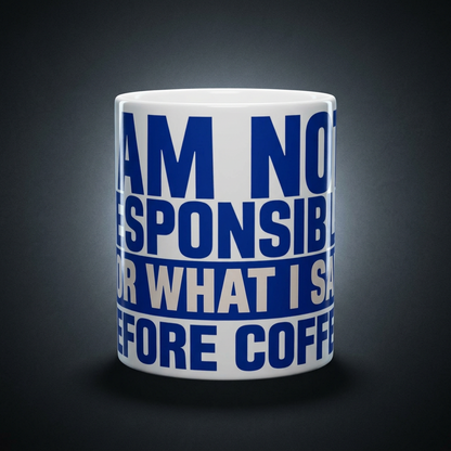 Funny coffee mug printed with "I AM NOT RESPONSIBLE FOR WHAT I SAY BEFORE COFFEE", shown on a dark studio background