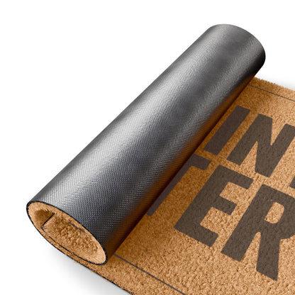 Rolled-up corner of the One Joint to Enter coir doormat showing the black vinyl backing