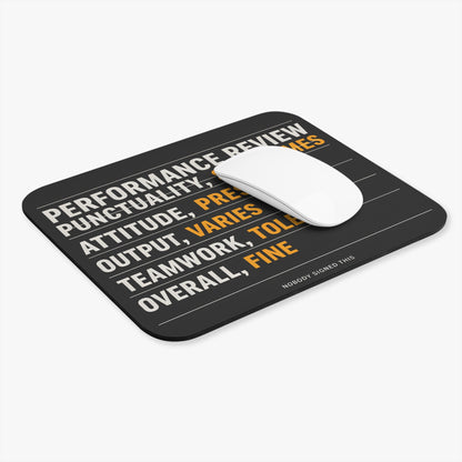 Performance review mouse pad at an angle with a white computer mouse