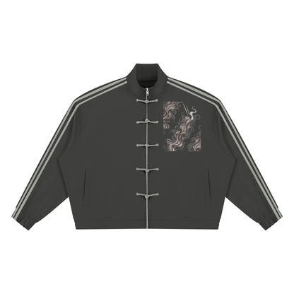 Dark gray striped stand collar track jacket, front view with frog button front, gray sleeve stripes and a wavy ribbon panel on the right chest
