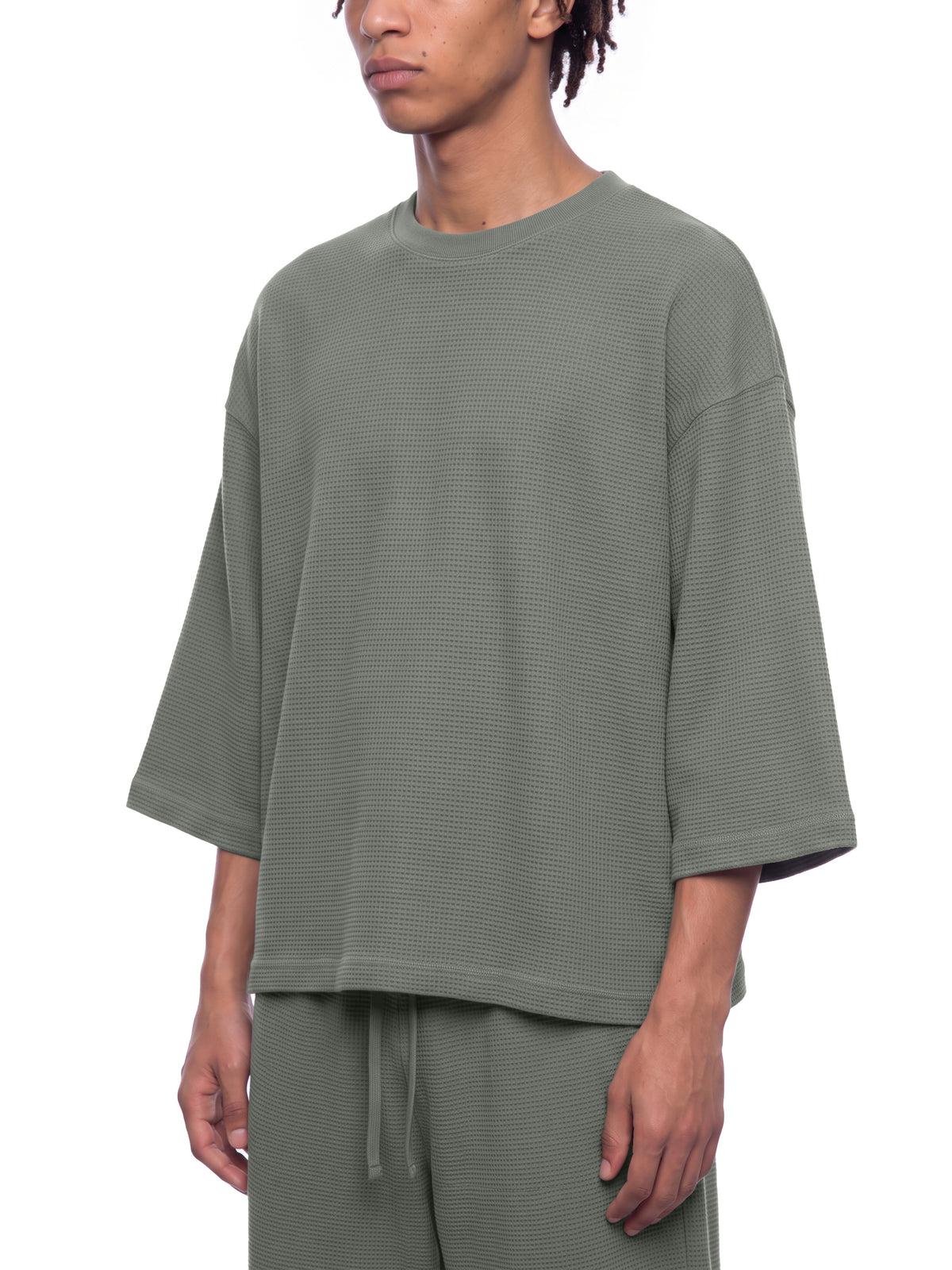 Model wearing the waffle knit boxy t-shirt in gray, front view